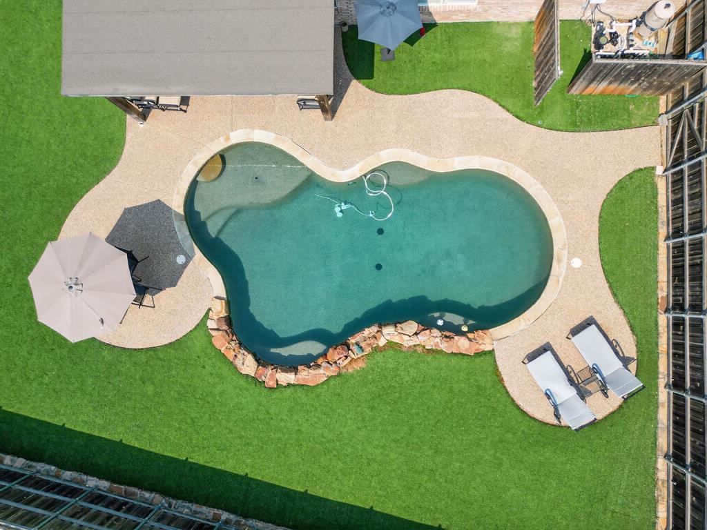 2052 Diamond Ridge Drive Carrollton, TX 75010 - Photo 3 of 40 a view of a swimming pool with a yard and outdoor seating