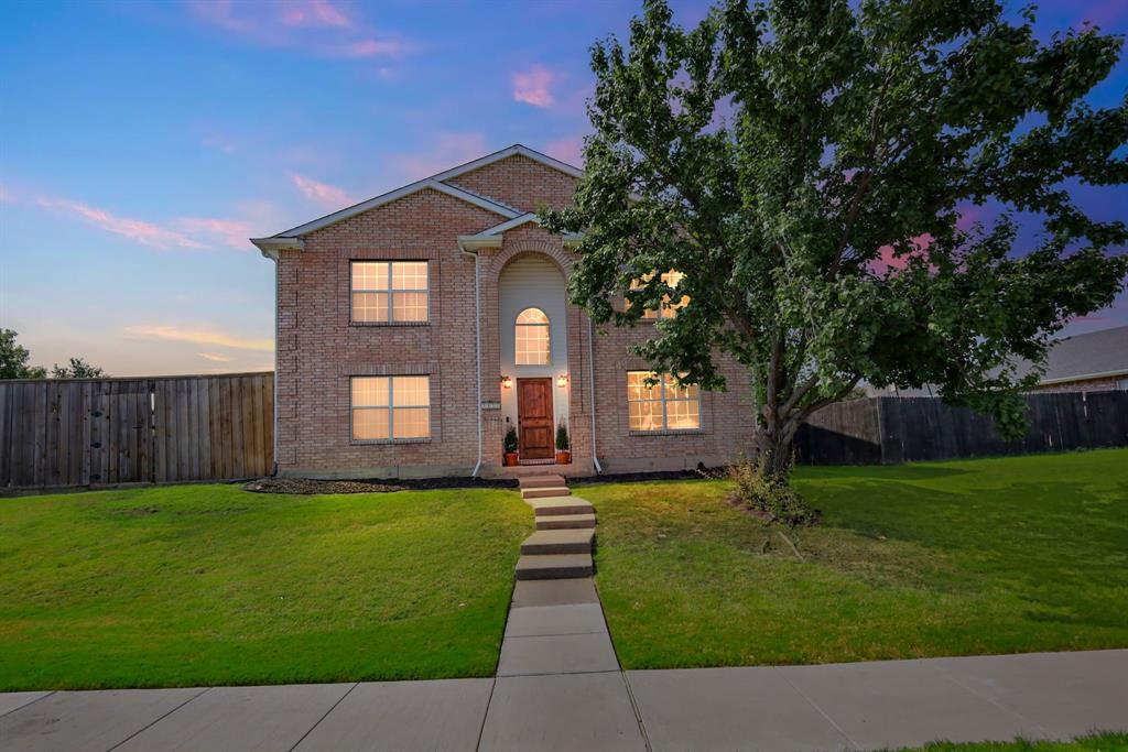 2052 Diamond Ridge Drive Carrollton, TX 75010 - Photo 40 of 40 a front view of a house with a yard