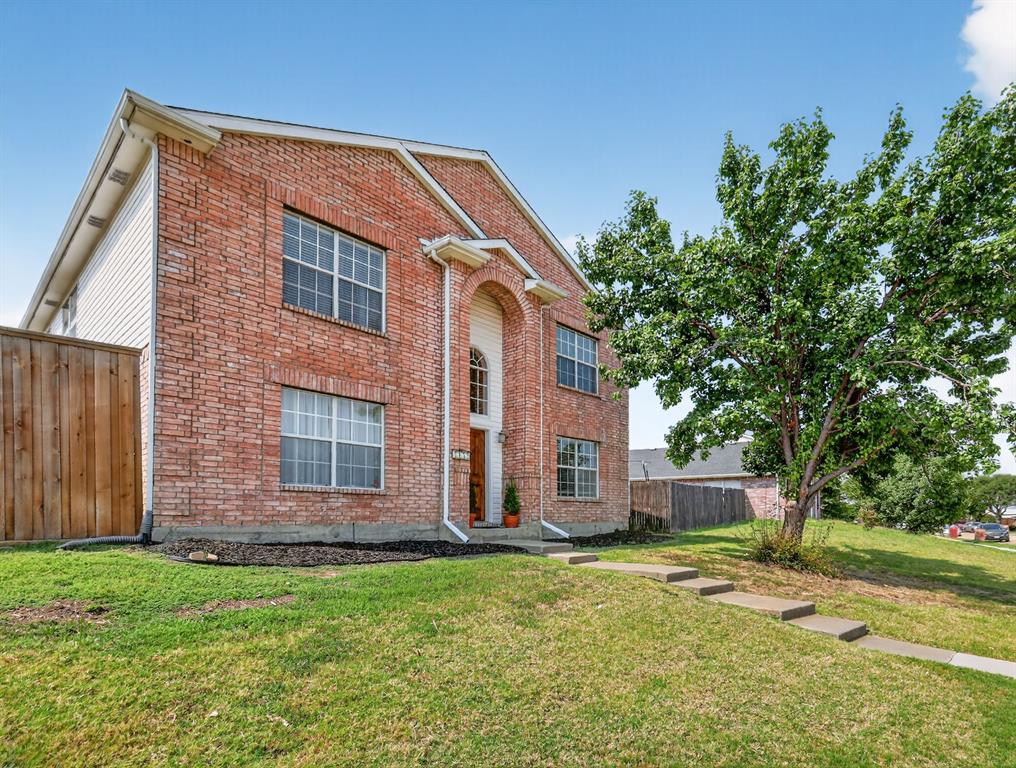 2052 Diamond Ridge Drive Carrollton, TX 75010 - Photo 5 of 40 a view of a house with a backyard