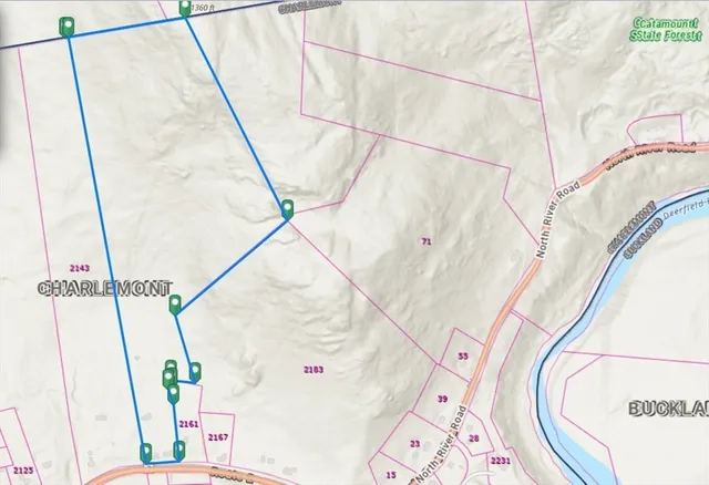 a bathroom with a sink and mirror with toilet