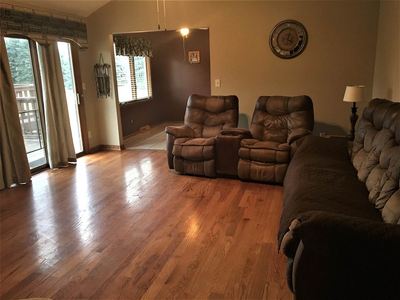 6282 Upper Ridge Way Roscoe, IL 61073 - Photo 2 of 23 a living room with couches and painted walls next to a window