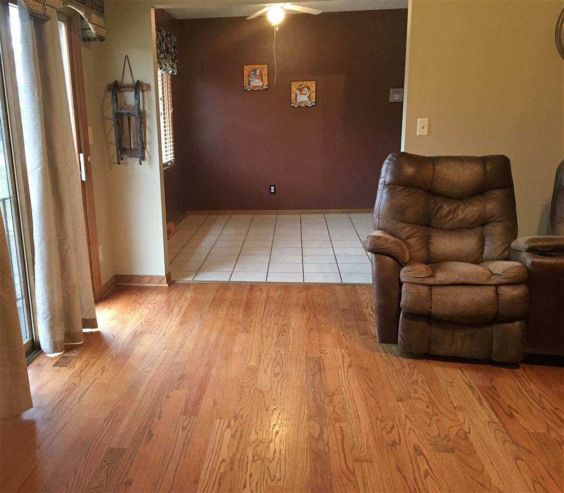 6282 Upper Ridge Way Roscoe, IL 61073 - Photo 3 of 23 a view of livingroom with furniture and wooden floor