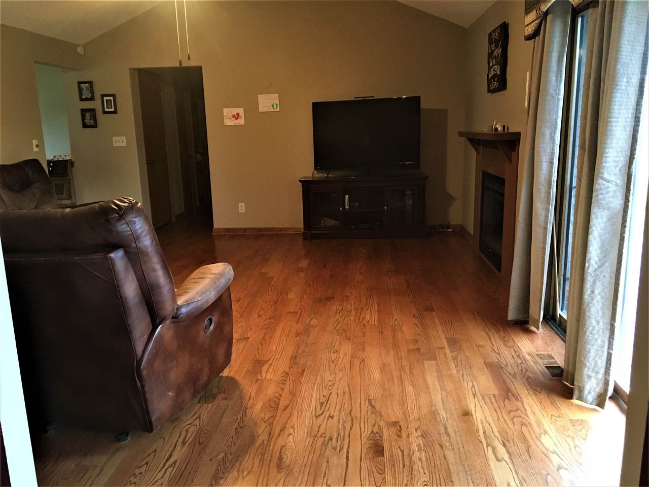 6282 Upper Ridge Way Roscoe, IL 61073 - Photo 4 of 23 a living room with furniture and a flat screen tv