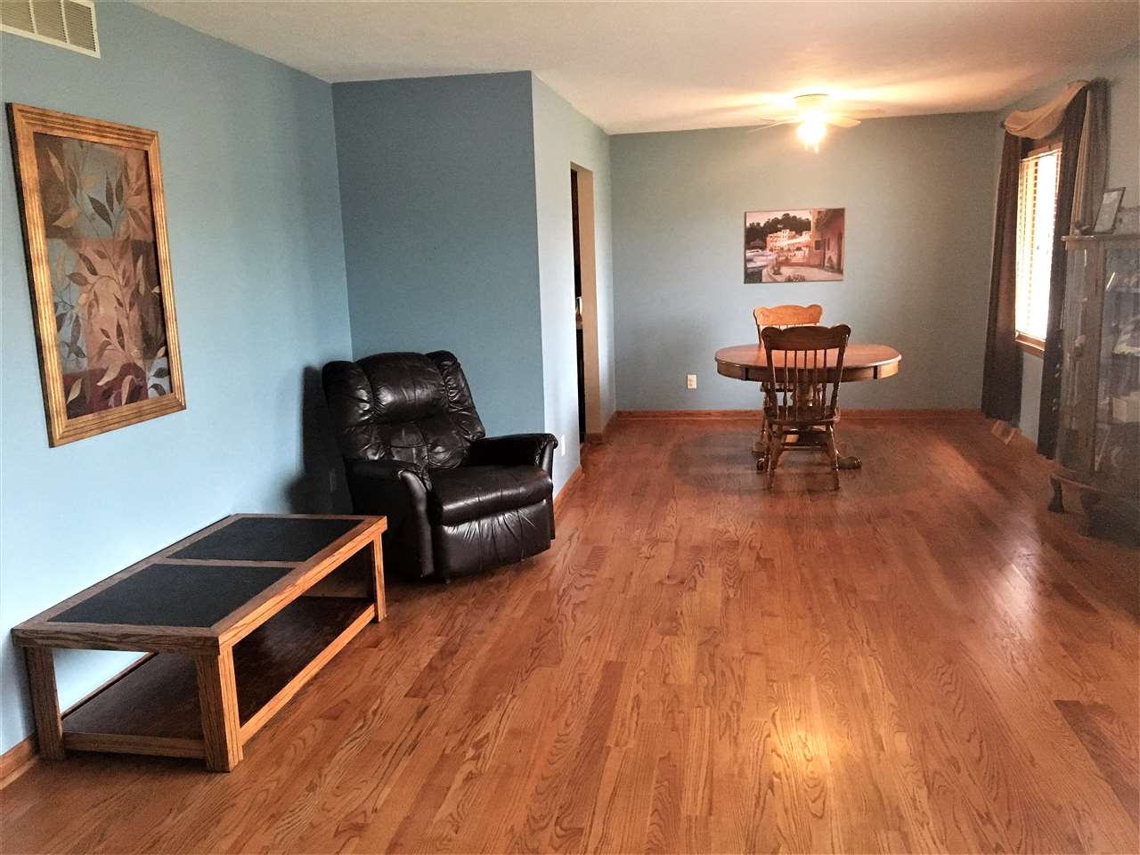 6282 Upper Ridge Way Roscoe, IL 61073 - Photo 6 of 23 a room with furniture and wooden floor