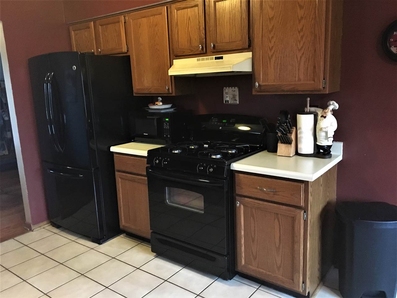 6282 Upper Ridge Way Roscoe, IL 61073 - Photo 7 of 23 a kitchen with a refrigerator and cabinets