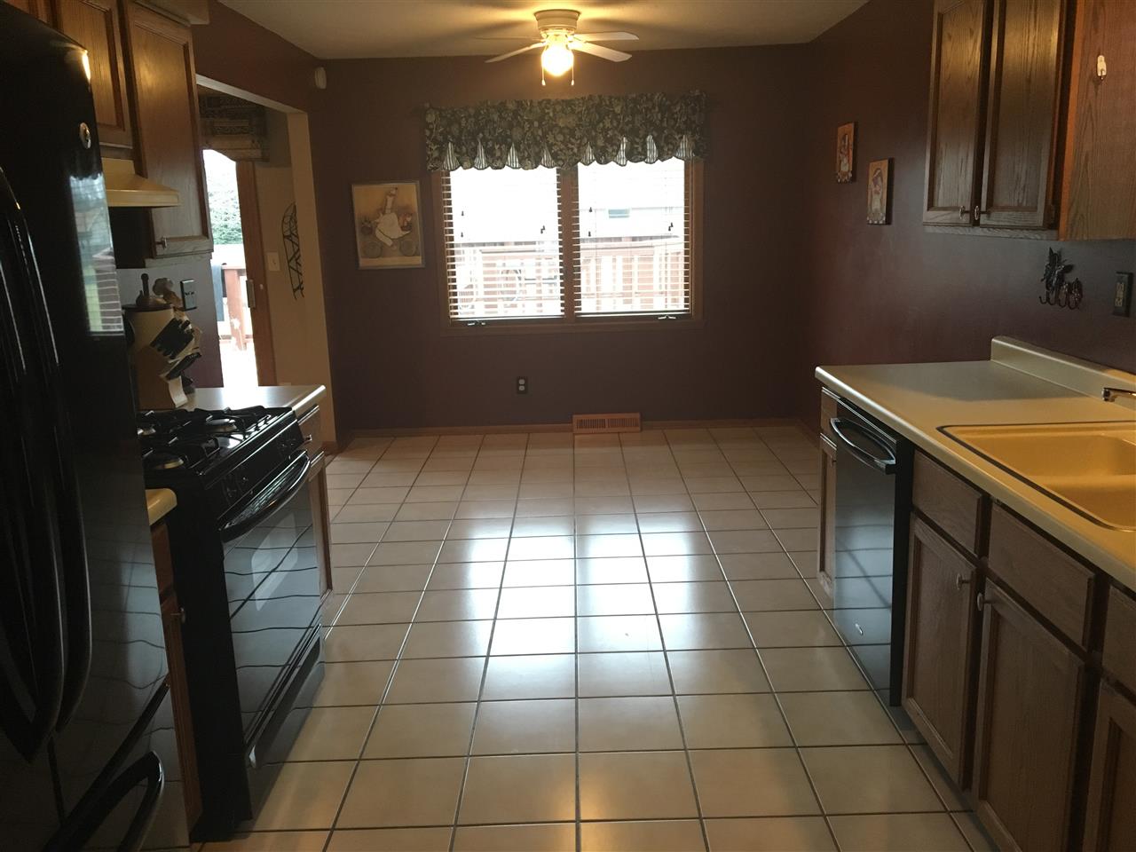 6282 Upper Ridge Way Roscoe, IL 61073 - Photo 8 of 23 a kitchen with a stove a sink and a refrigerator