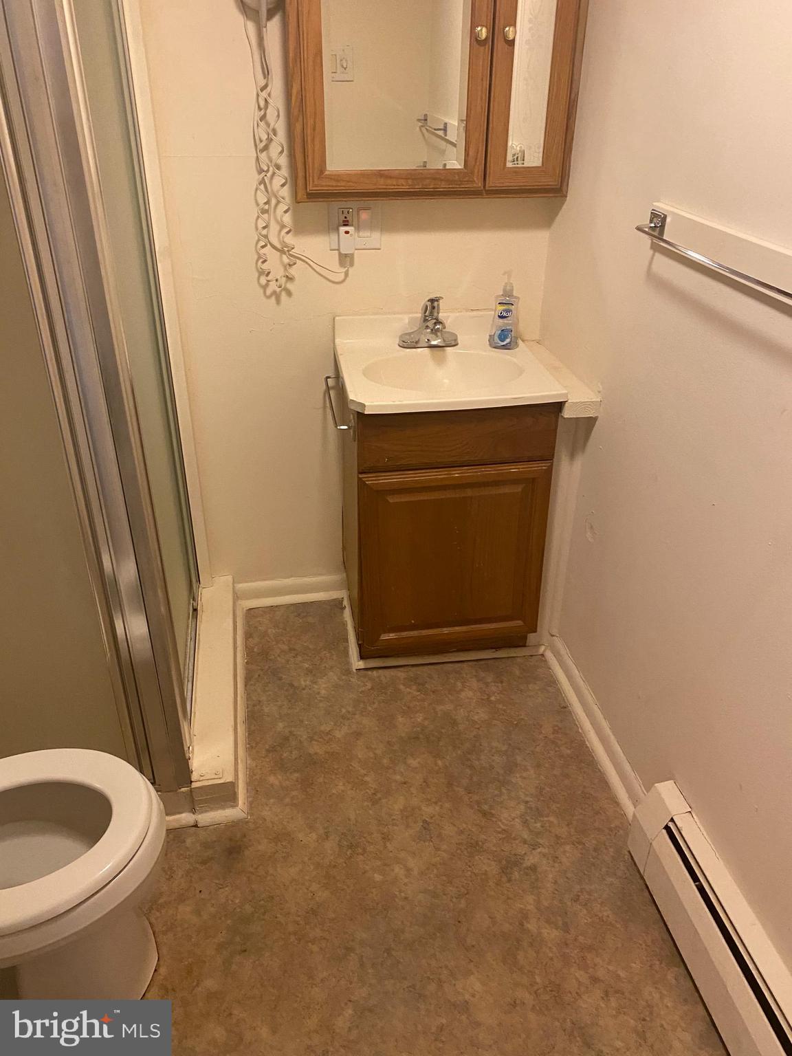 220 Crystal Drive Williamstown, NJ 08094 - Photo 16 of 16 a bathroom with a sink a toilet and a mirror