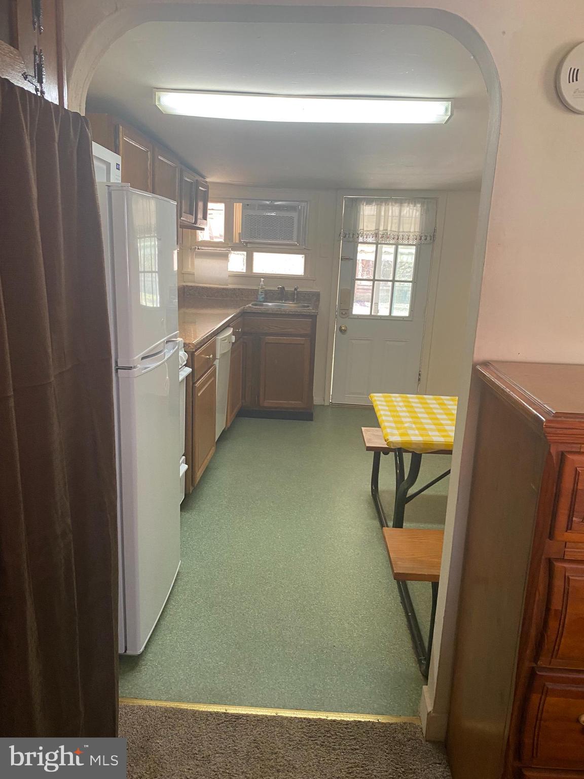 220 Crystal Drive Williamstown, NJ 08094 - Photo 9 of 16 a view of a kitchen with furniture and a refrigerator