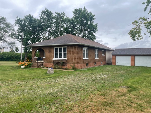 1116 North 29th Road Ottawa, IL 61350 - Photo 6 of 9 a front view of a house with a garden