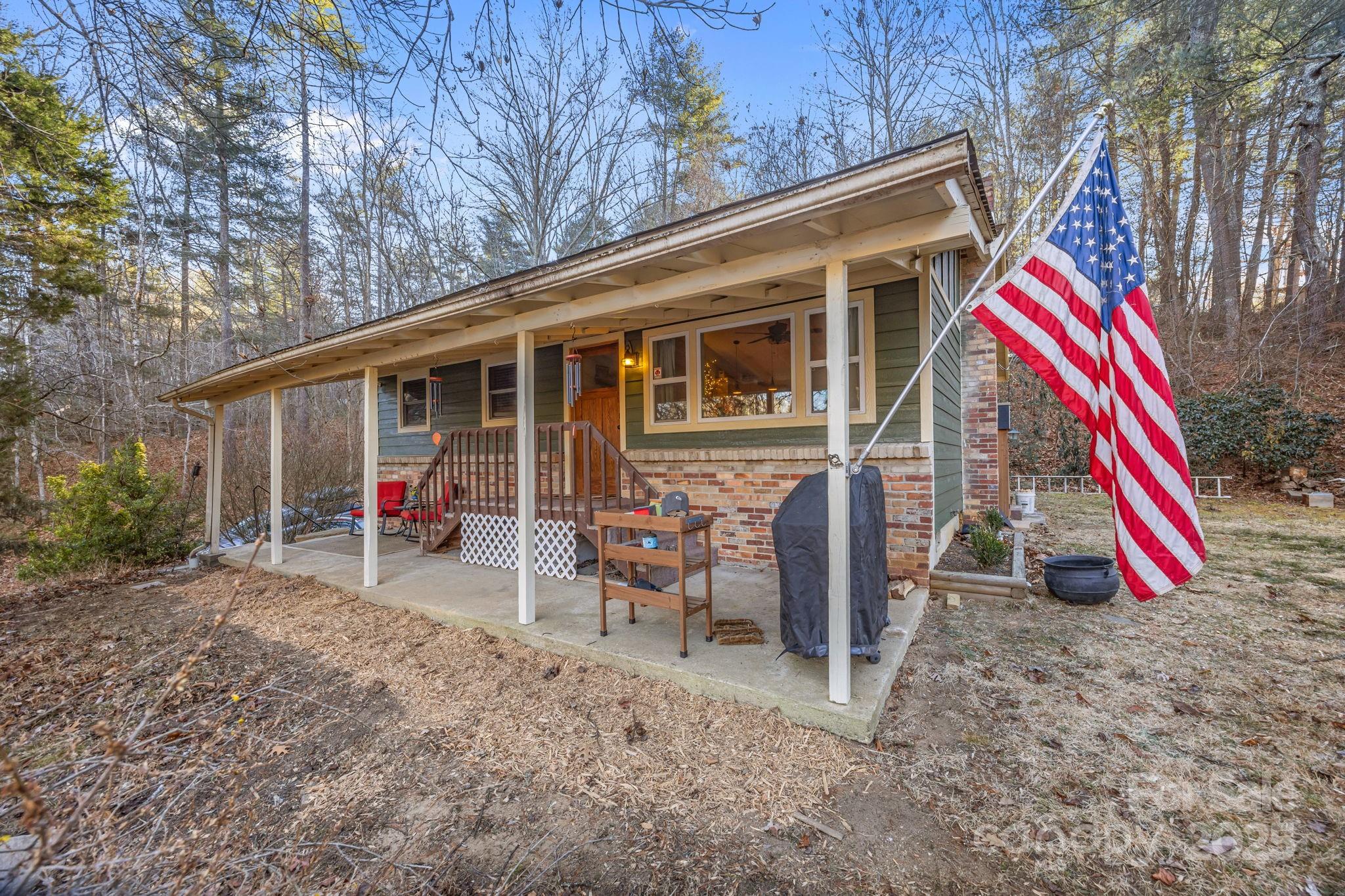 a view of wooden deck with chairs and table