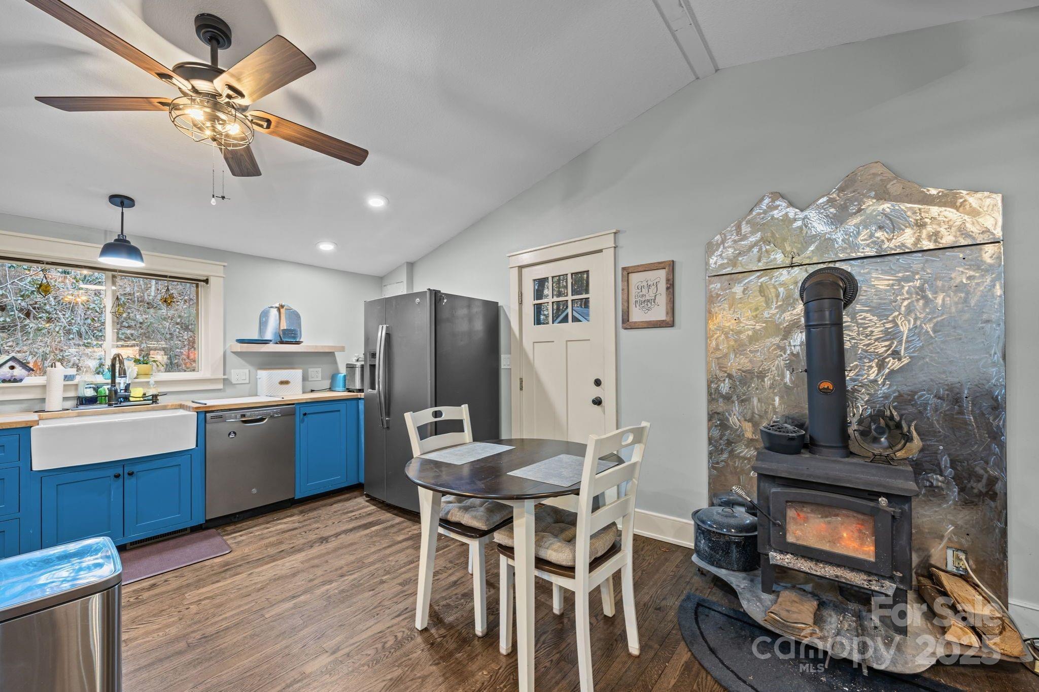 2144 Wilson Road Asheville, NC 28806 - Photo 11 of 27 a kitchen with refrigerator and cabinets
