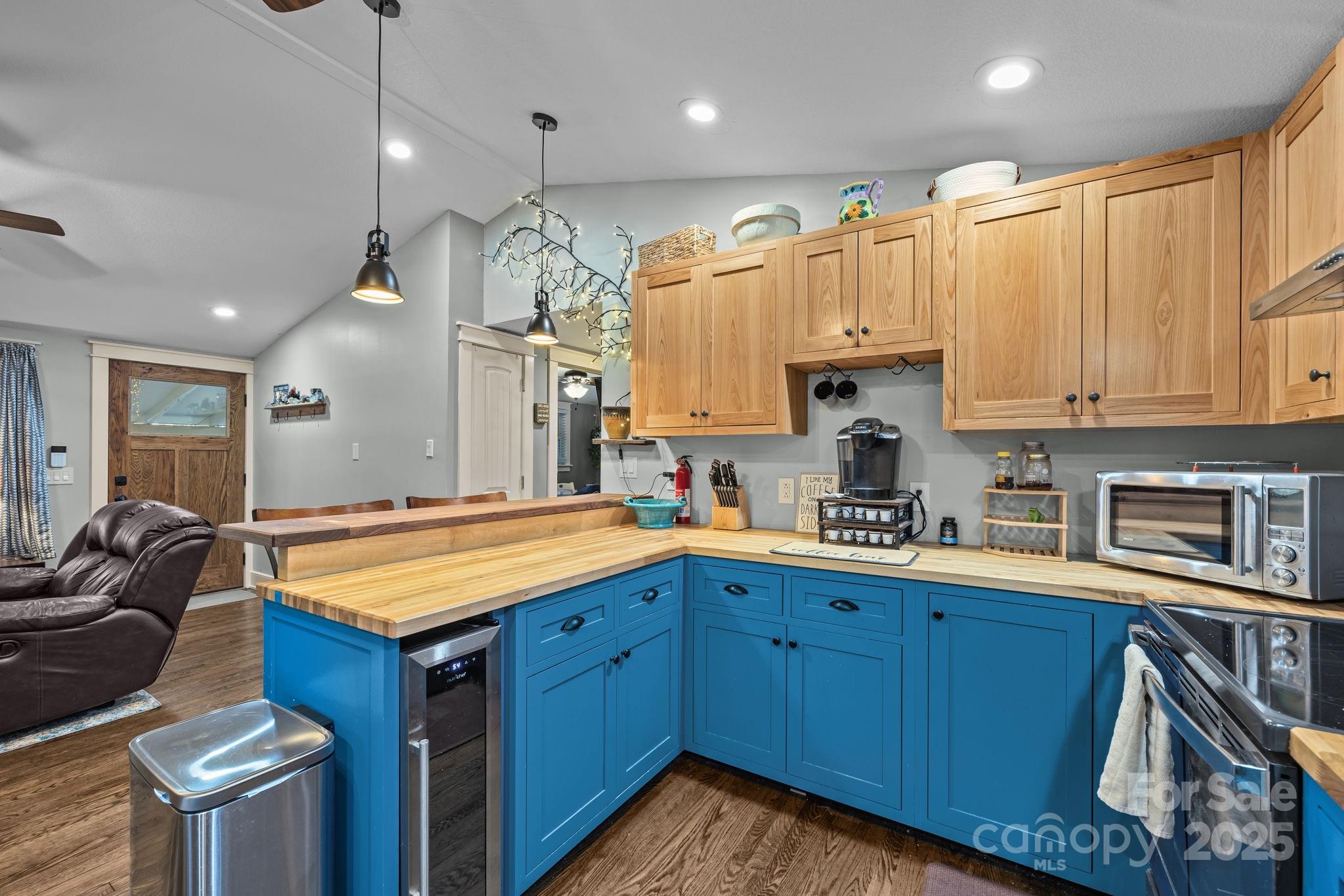 2144 Wilson Road Asheville, NC 28806 - Photo 12 of 27 a kitchen with granite countertop a sink a stove and cabinets