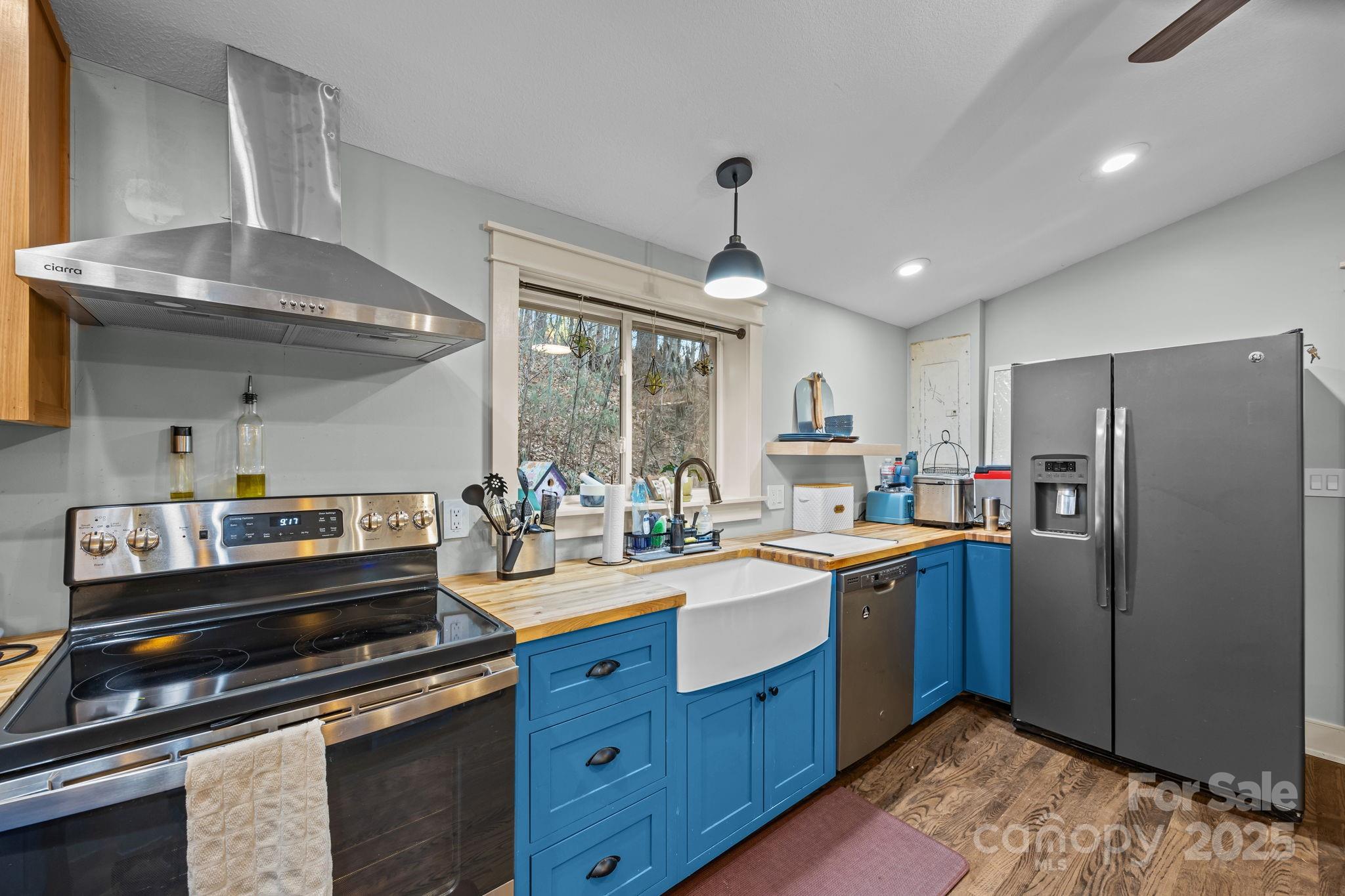 2144 Wilson Road Asheville, NC 28806 - Photo 14 of 27 a kitchen with sink a stove and cabinets