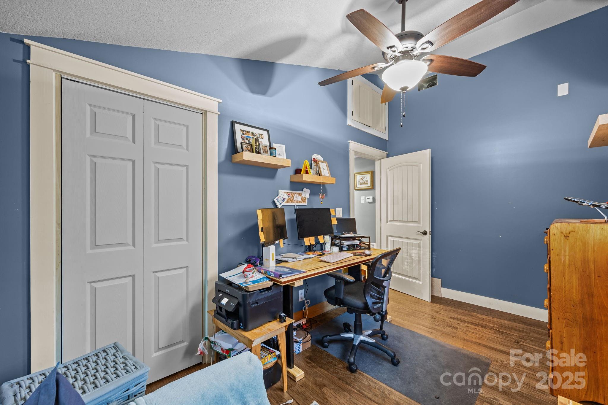 2144 Wilson Road Asheville, NC 28806 - Photo 19 of 27 a workspace with furniture and wooden floor