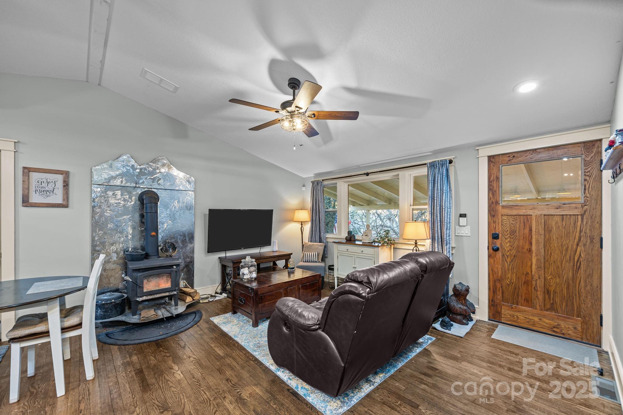 2144 Wilson Road Asheville, NC 28806 - Photo 2 of 27 a living room with furniture and a flat screen tv