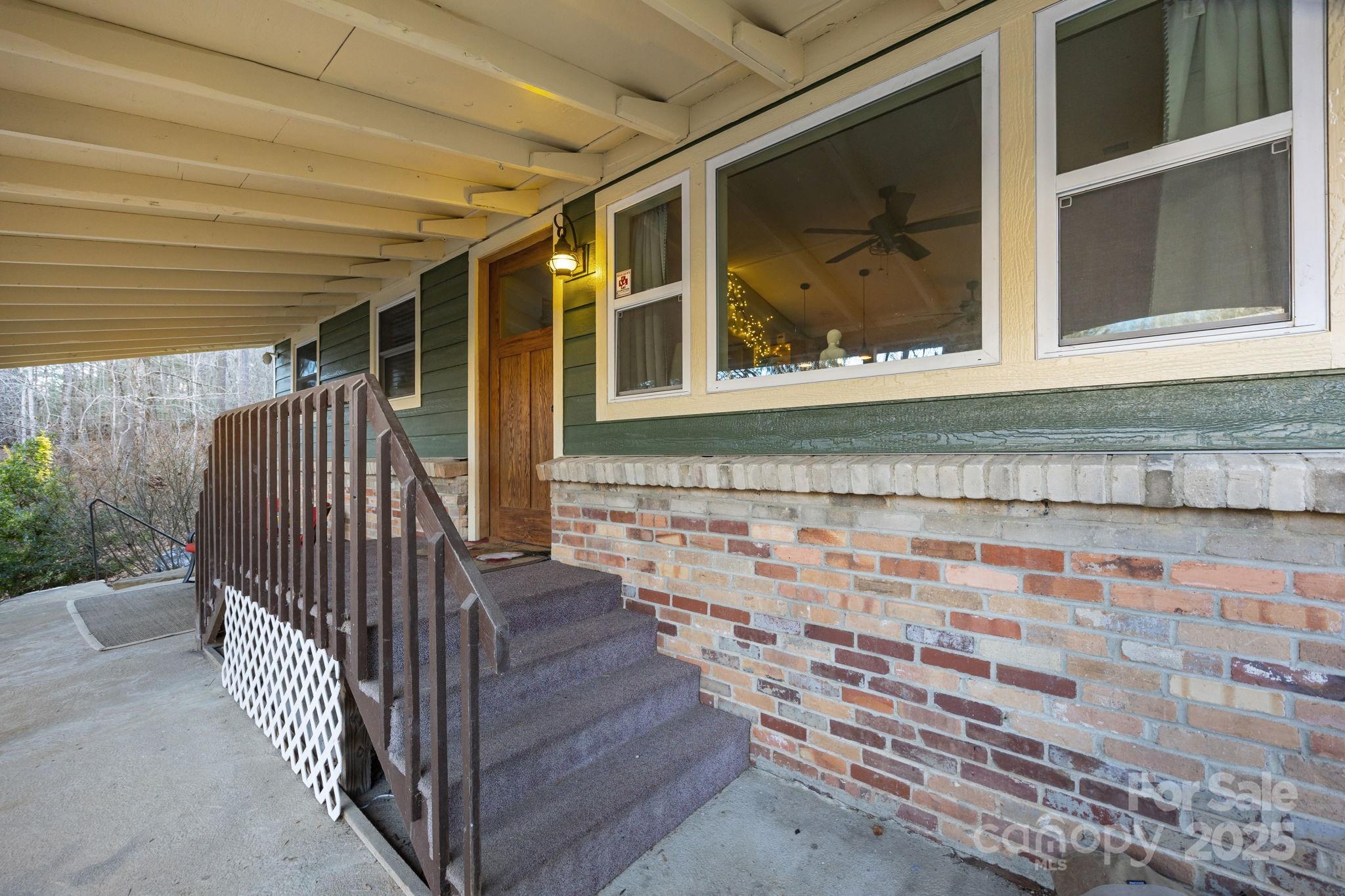 2144 Wilson Road Asheville, NC 28806 - Photo 24 of 27 a view of house with wooden floor and a window
