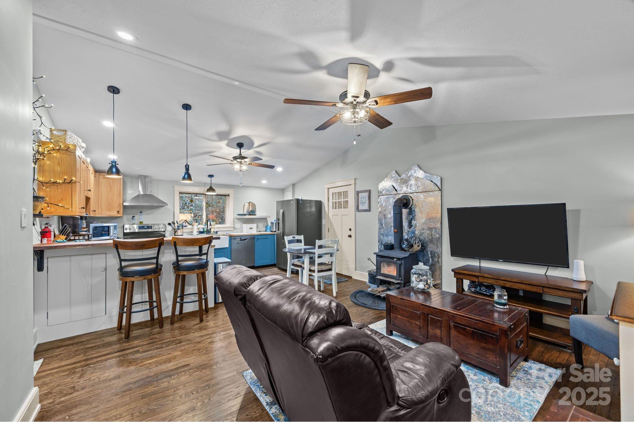 2144 Wilson Road Asheville, NC 28806 - Photo 4 of 27 a living room with furniture and a flat screen tv