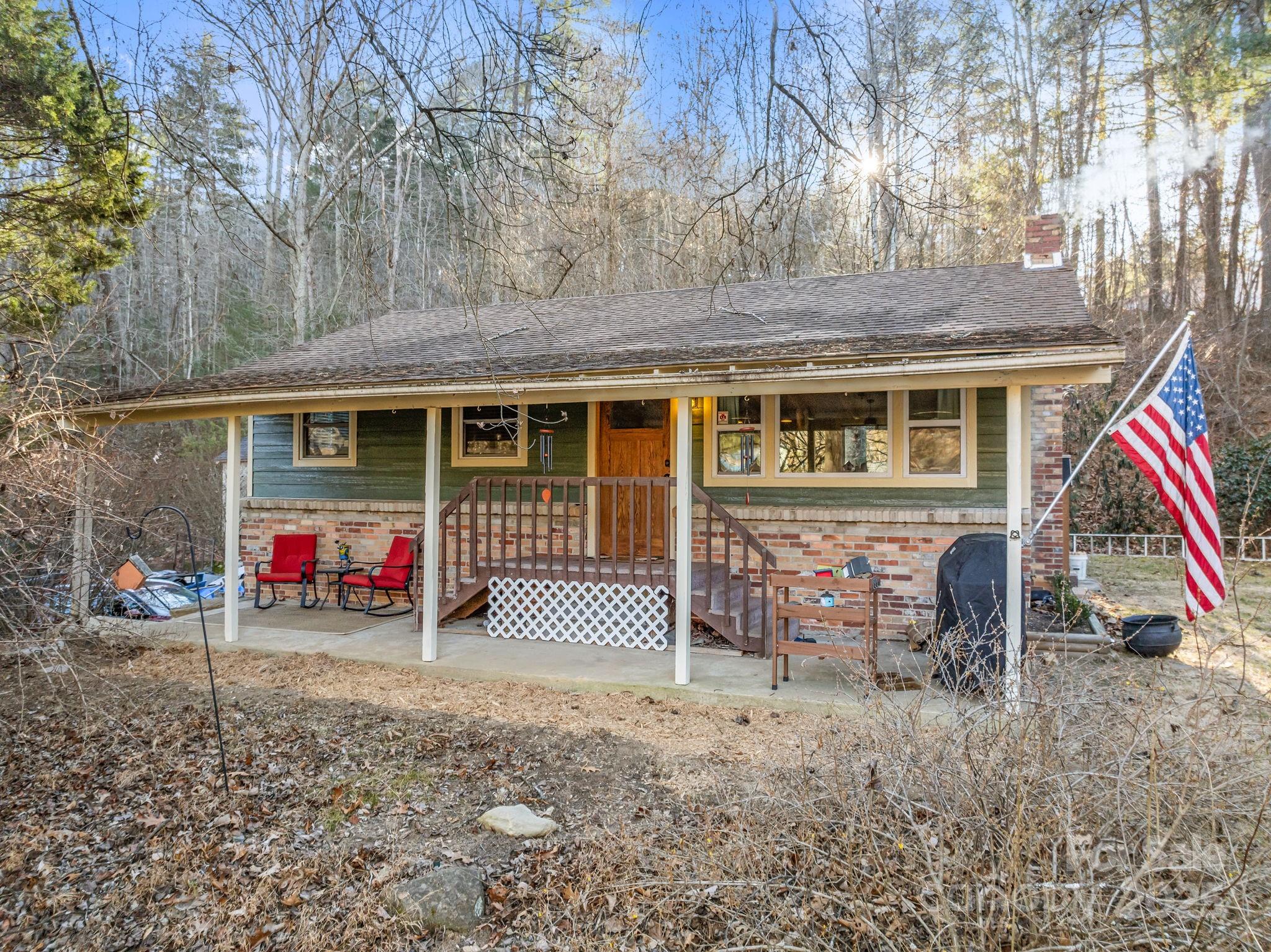 2144 Wilson Road Asheville, NC 28806 - Photo 6 of 27 a view of house with a yard and a large tree