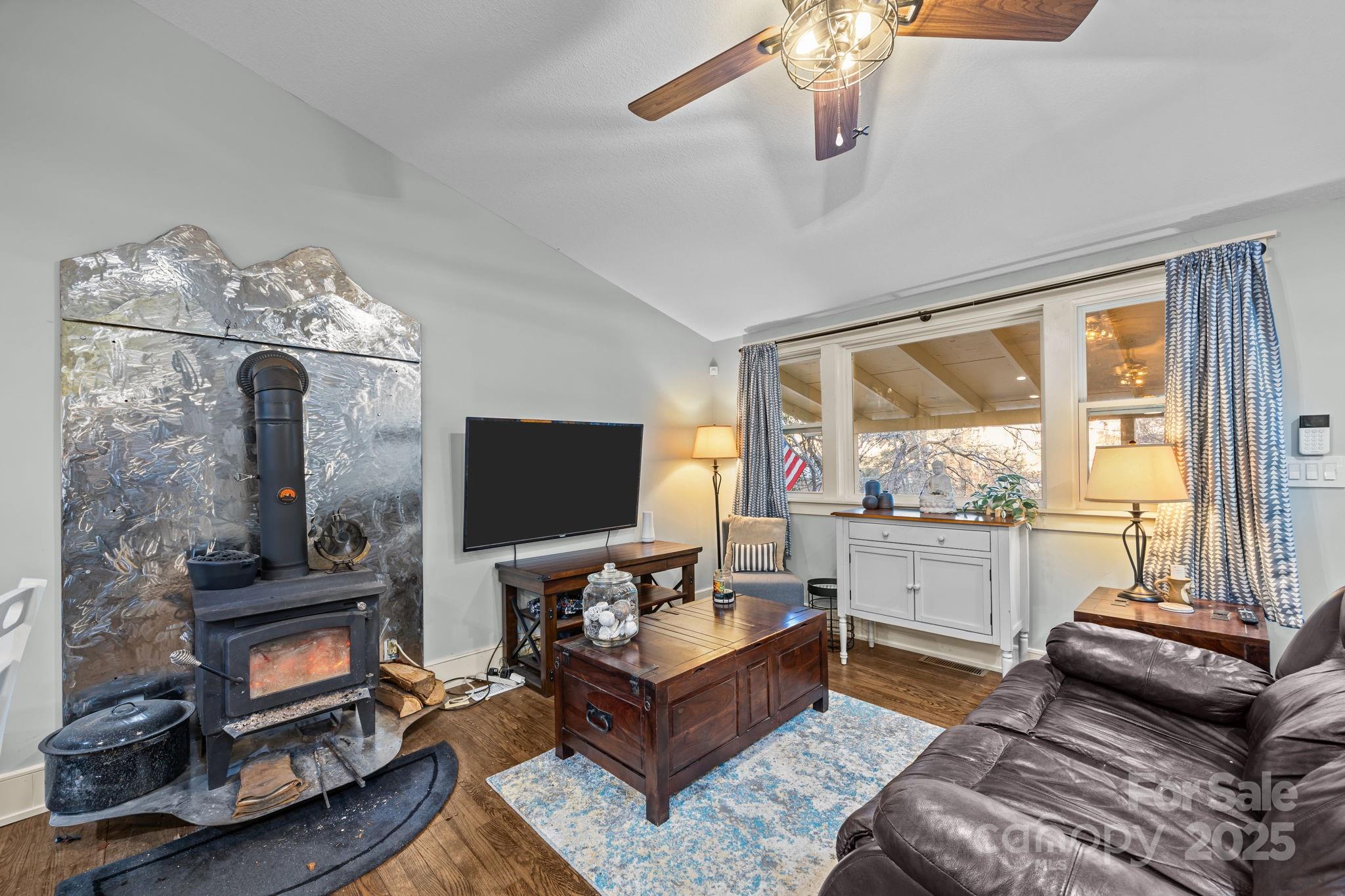 2144 Wilson Road Asheville, NC 28806 - Photo 10 of 27 a living room with furniture and a flat screen tv