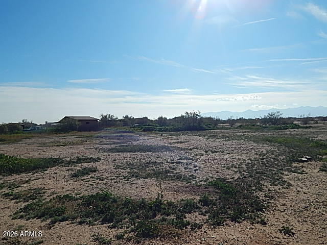 24231 West Patton Road Wittmann, AZ 85361 - Photo 12 of 12 a view of a lake with mountain in the background