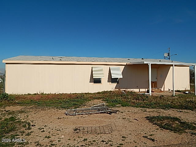 24231 West Patton Road Wittmann, AZ 85361 - Photo 2 of 12 a view of a yard with wooden fence