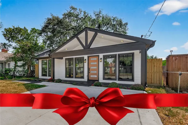 a view of a house with backyard porch and sitting area