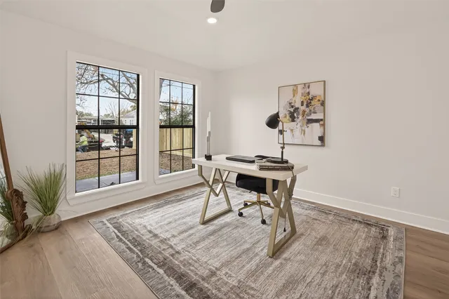 a view of a workspace with furniture