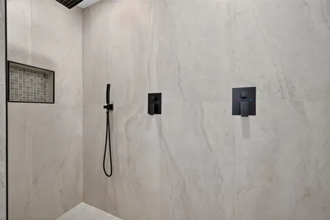 a bathroom with a double vanity sink and mirror