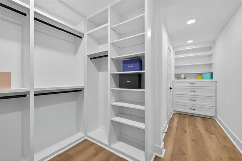 a workspace with wooden floor and a window