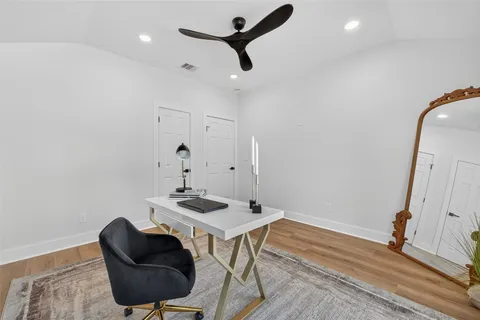 a bathroom with a sink vanity and a mirror