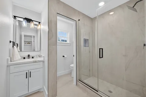 a view of house with backyard and seating area