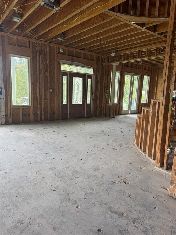83 Bass Road Pottsboro, TX 75076 - Photo 27 of 31 Open-concept interior framing with exposed ceiling joists and subflooring