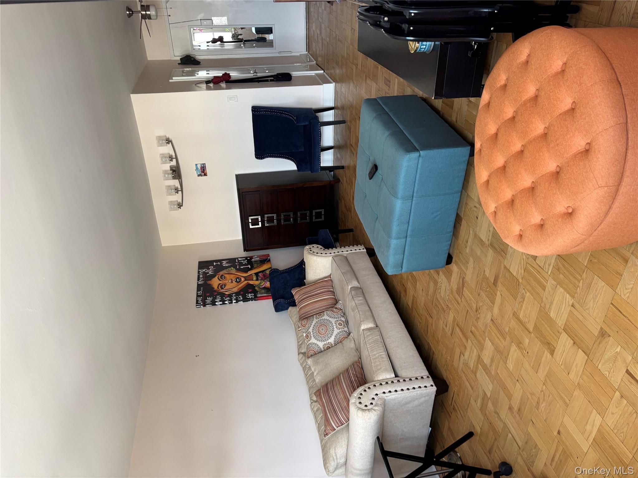 102-10 66th Road, Unit 14C Queens, NY 11375 - Photo 2 of 10 Living area featuring ceiling fan