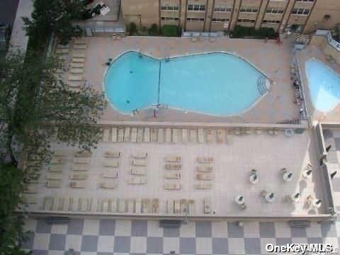 102-10 66th Road, Unit 14C Queens, NY 11375 - Photo 6 of 10 Aerial view of a pool area