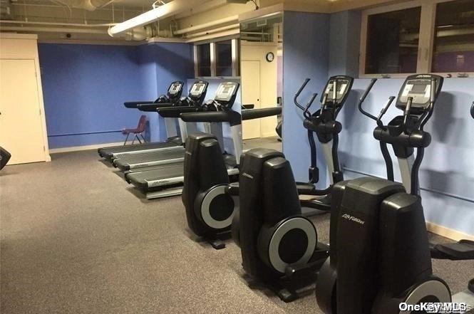 102-10 66th Road, Unit 14C Queens, NY 11375 - Photo 8 of 10 Gym featuring baseboards