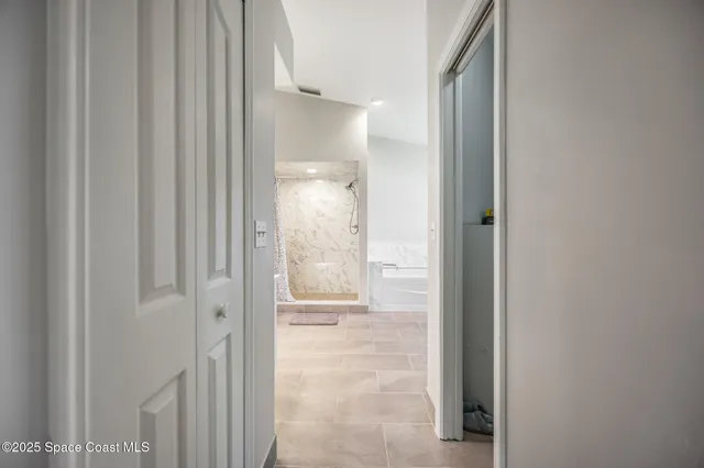a view of a bathroom from a hallway