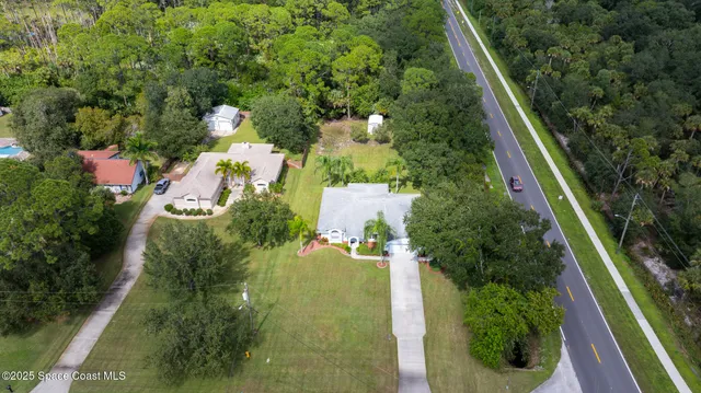 an aerial view of residential house with outdoor space
