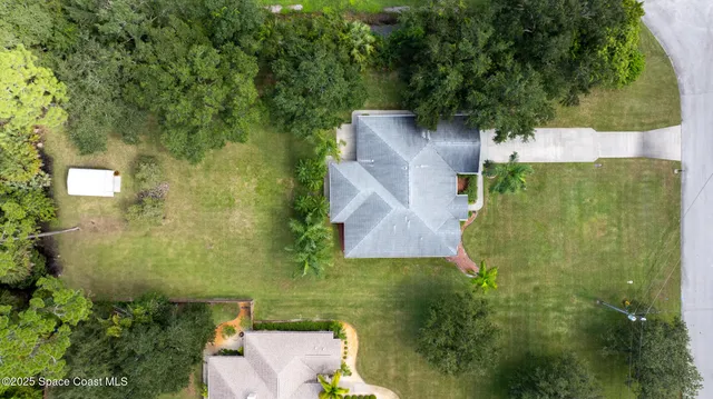 an aerial view of residential house with outdoor space