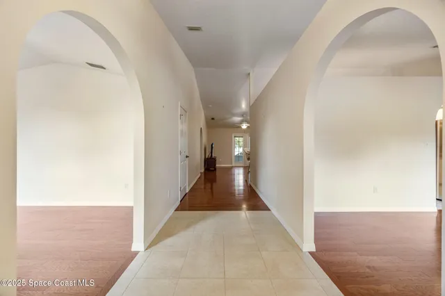 a view of a hallway with white walls