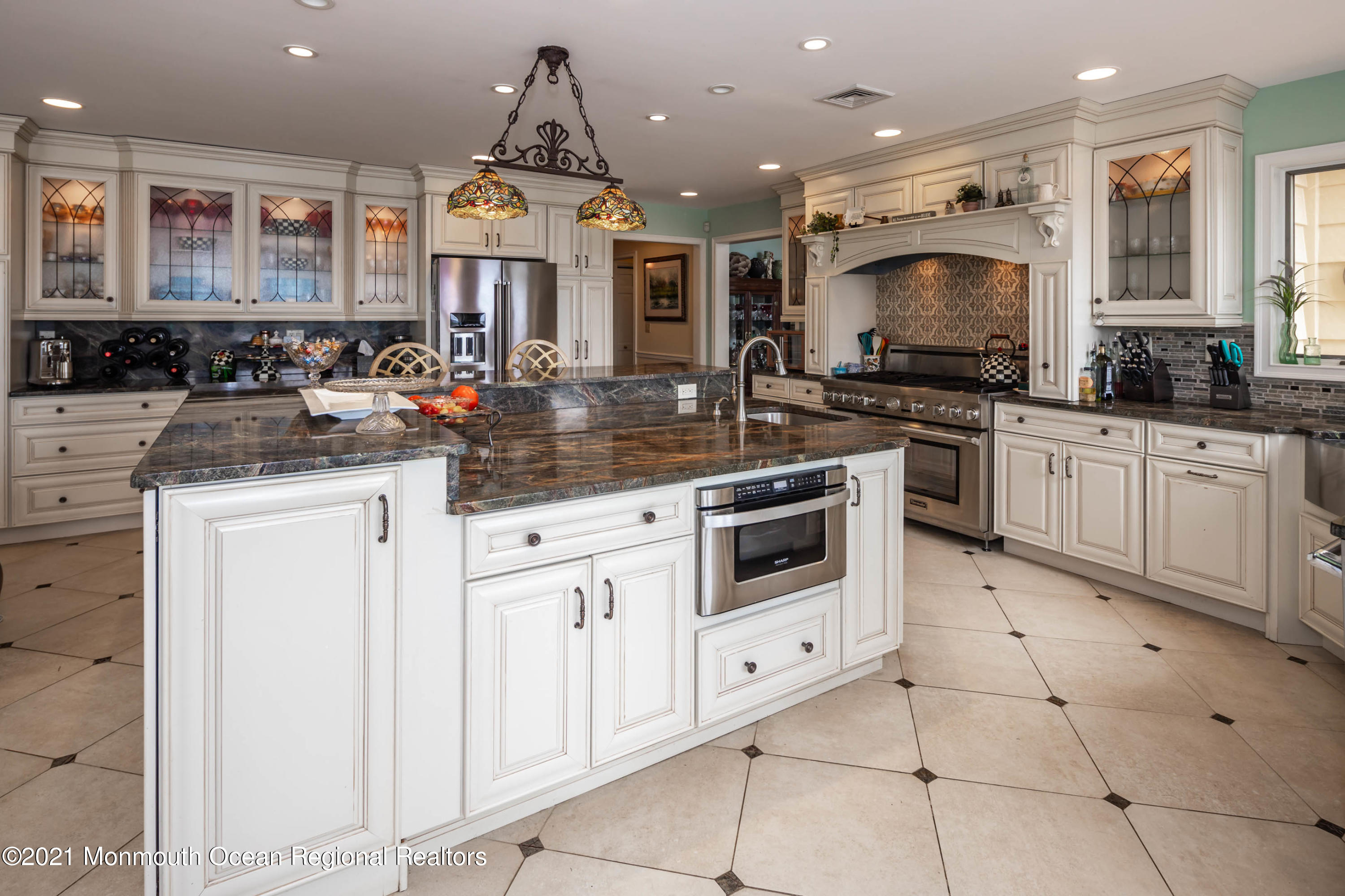 38 Conover Lane Red Bank, NJ 07701 - Photo 16 of 65 a kitchen with stainless steel appliances granite countertop a sink and a stove