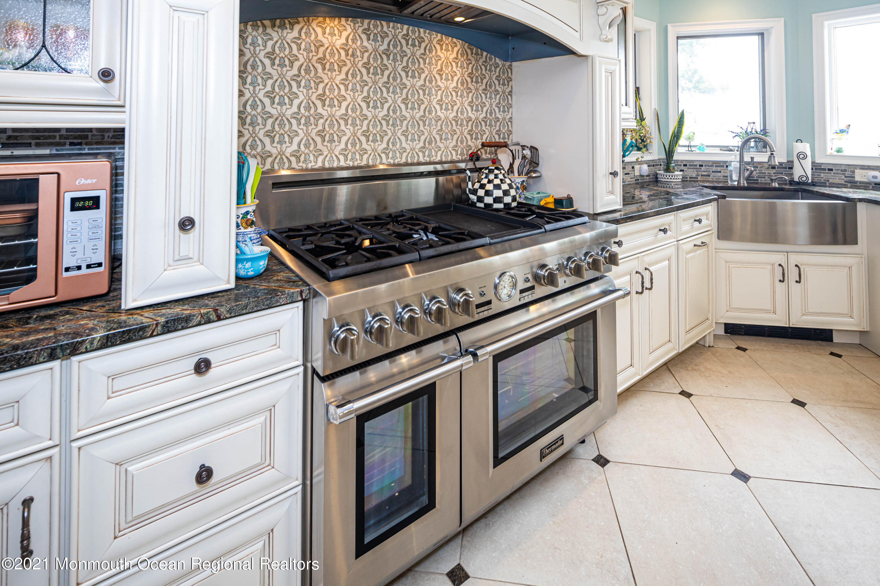 38 Conover Lane Red Bank, NJ 07701 - Photo 18 of 65 a white stove top oven sitting inside of a kitchen