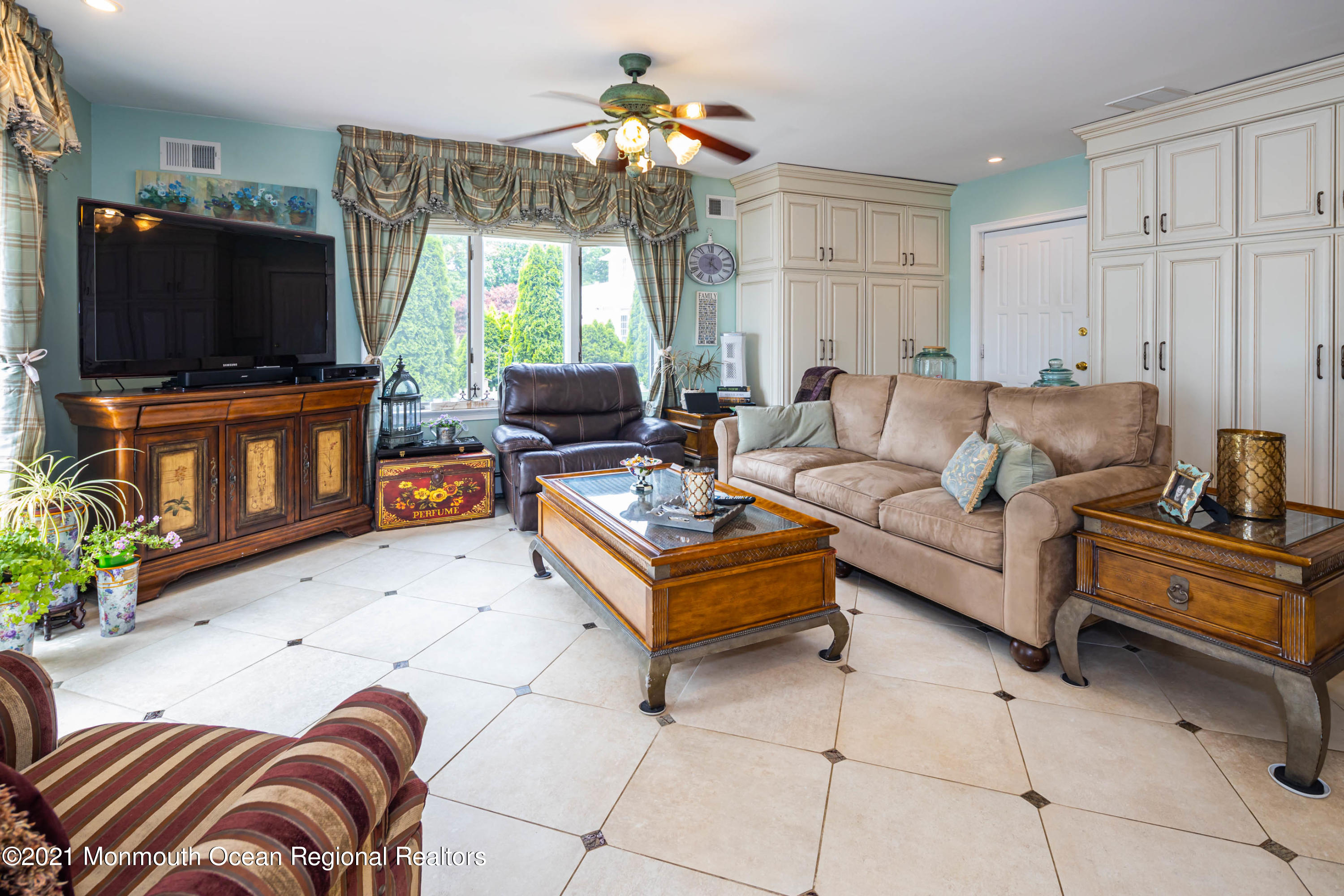 38 Conover Lane Red Bank, NJ 07701 - Photo 21 of 65 a living room with furniture and a flat screen tv