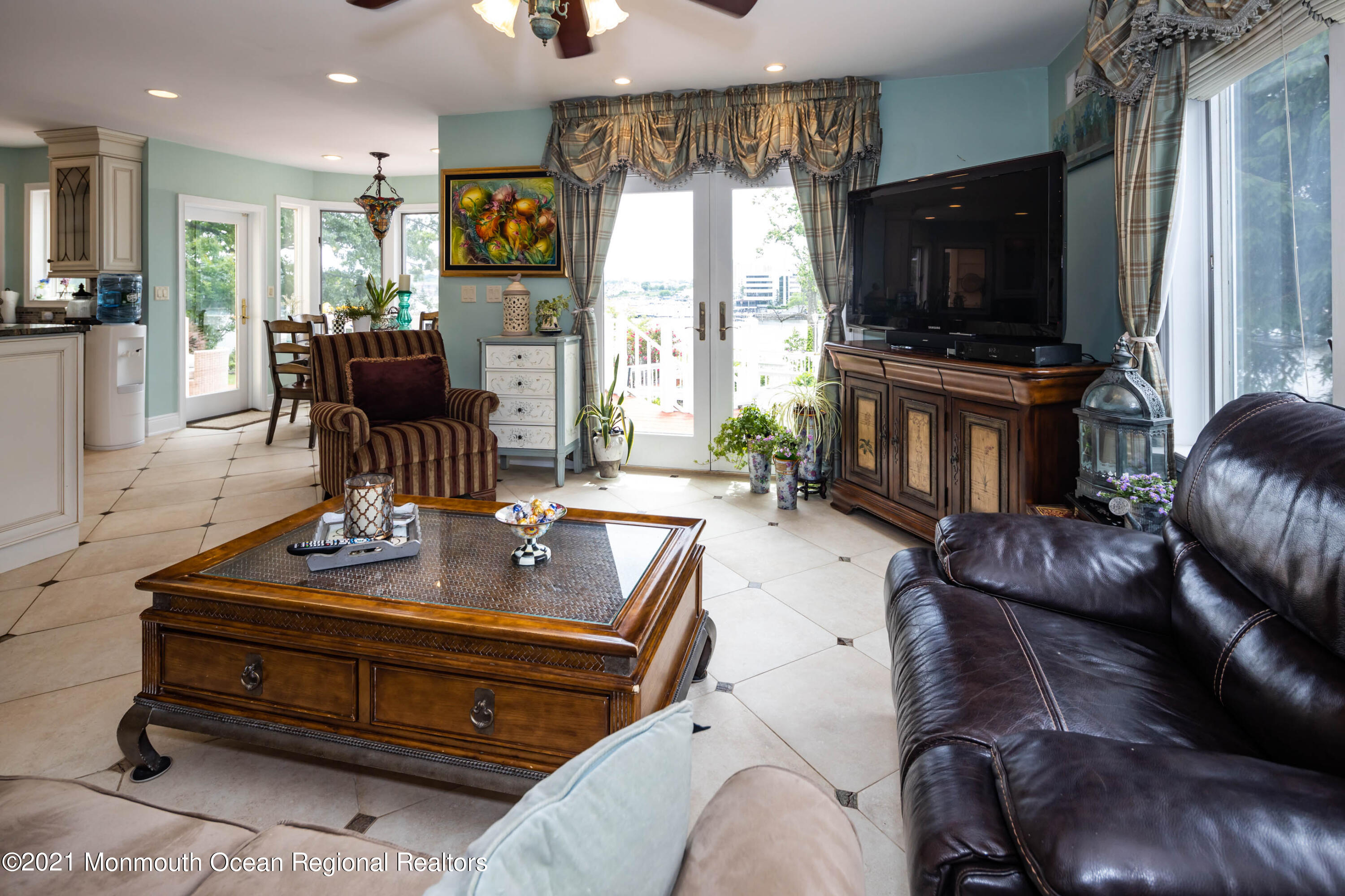 38 Conover Lane Red Bank, NJ 07701 - Photo 23 of 65 a living room with furniture a flat screen tv and a large window