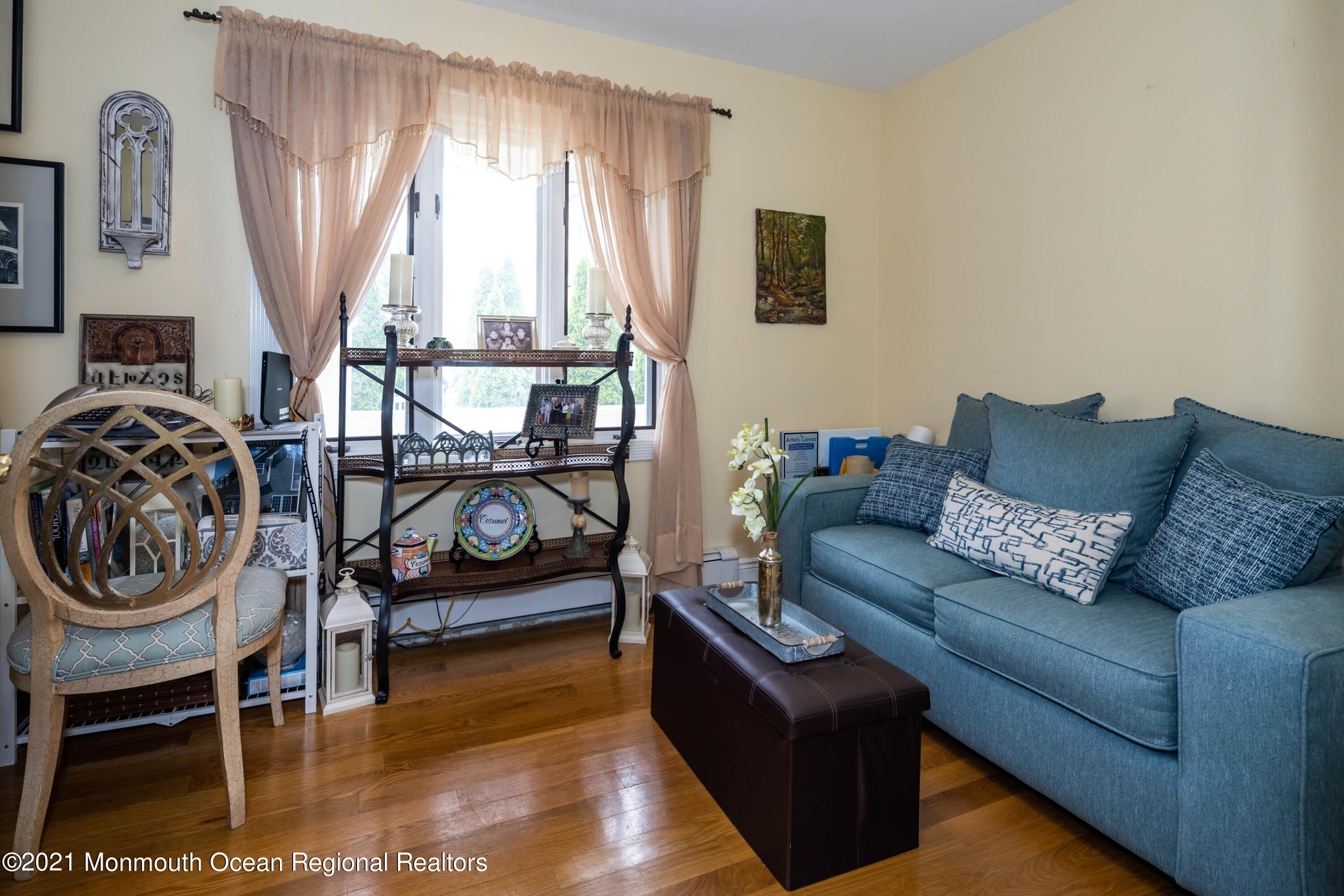 38 Conover Lane Red Bank, NJ 07701 - Photo 27 of 65 a living room with furniture a flat screen tv and a window