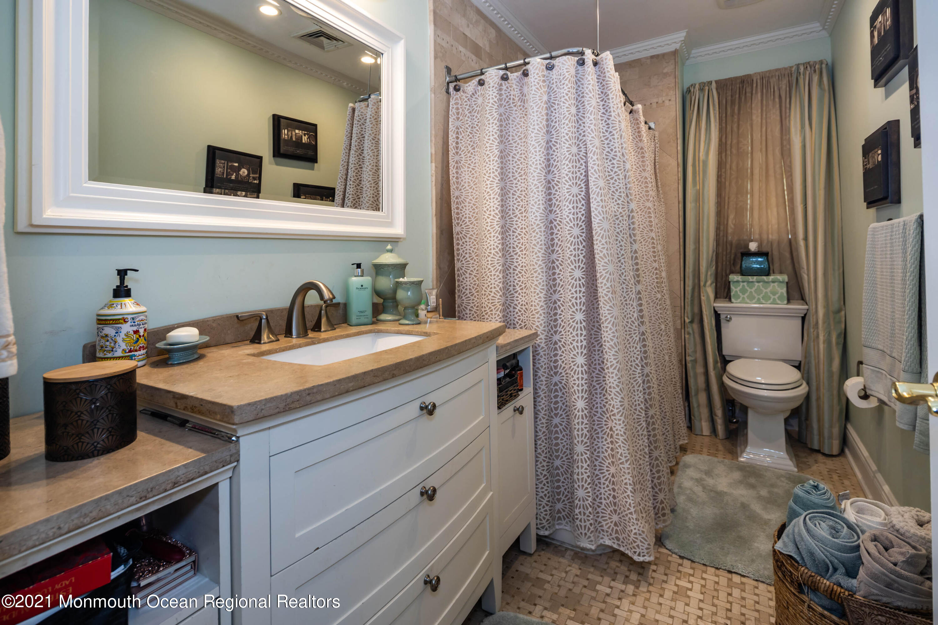 38 Conover Lane Red Bank, NJ 07701 - Photo 31 of 65 a bathroom with a sink a toilet and mirror