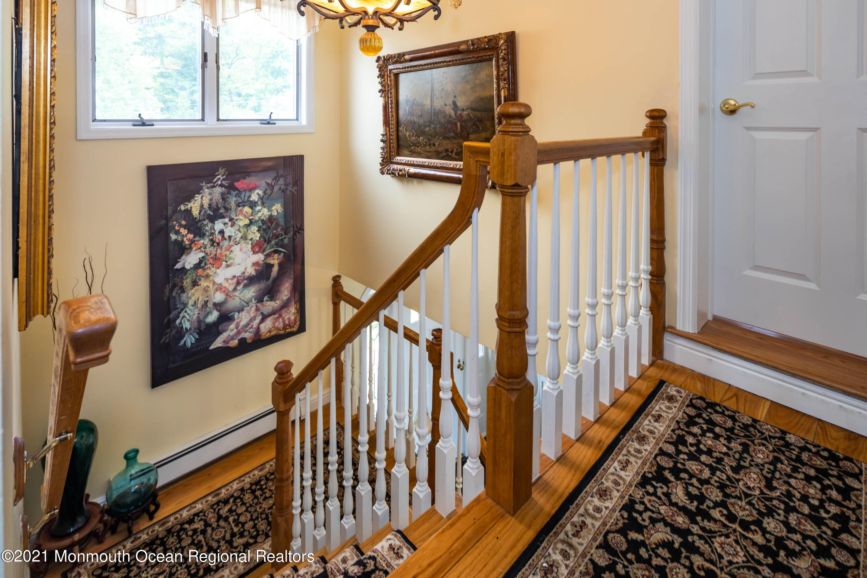 38 Conover Lane Red Bank, NJ 07701 - Photo 32 of 65 a view of a hallway with wooden floor and staircase