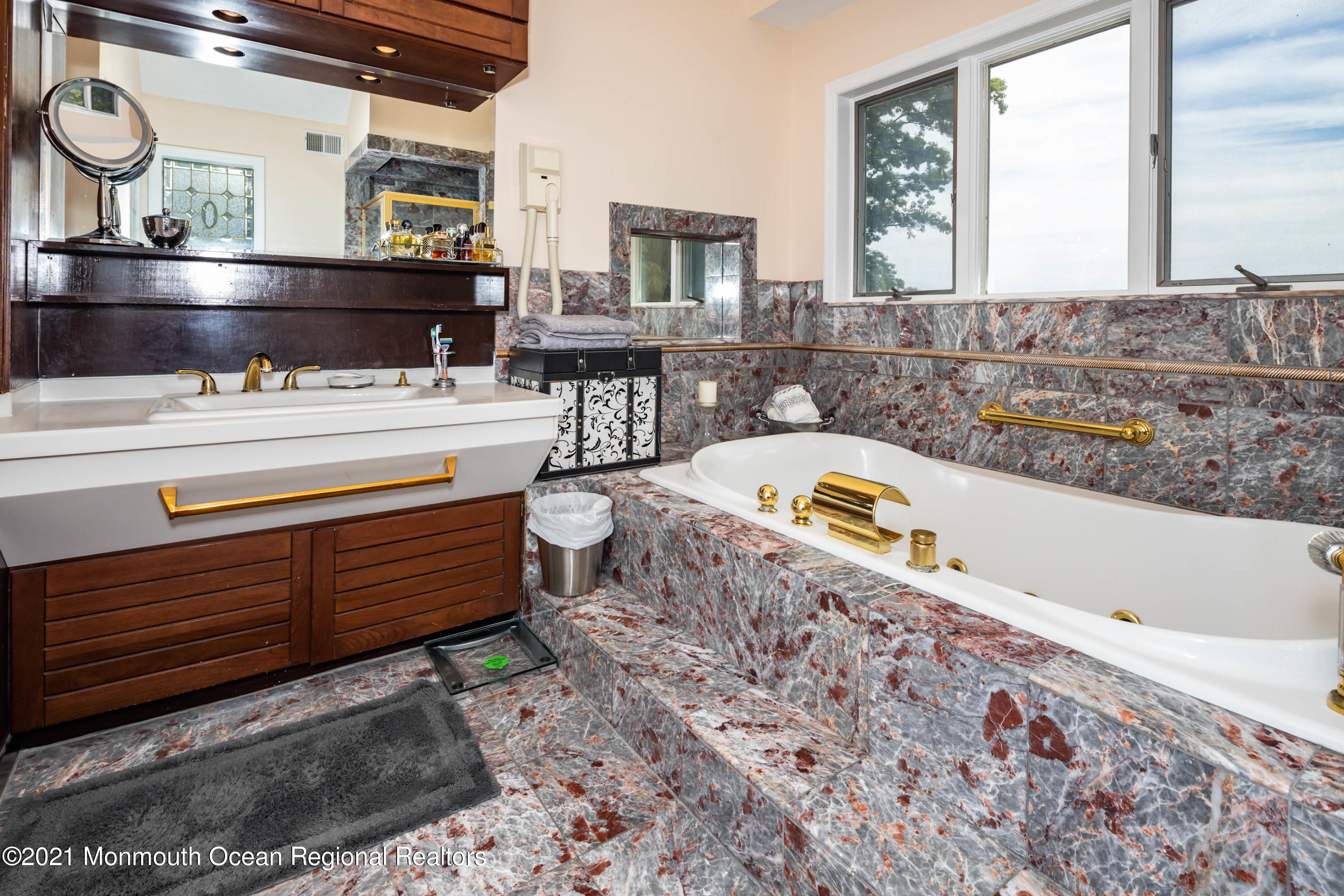 38 Conover Lane Red Bank, NJ 07701 - Photo 37 of 65 a bathroom with a bathtub sink and mirror