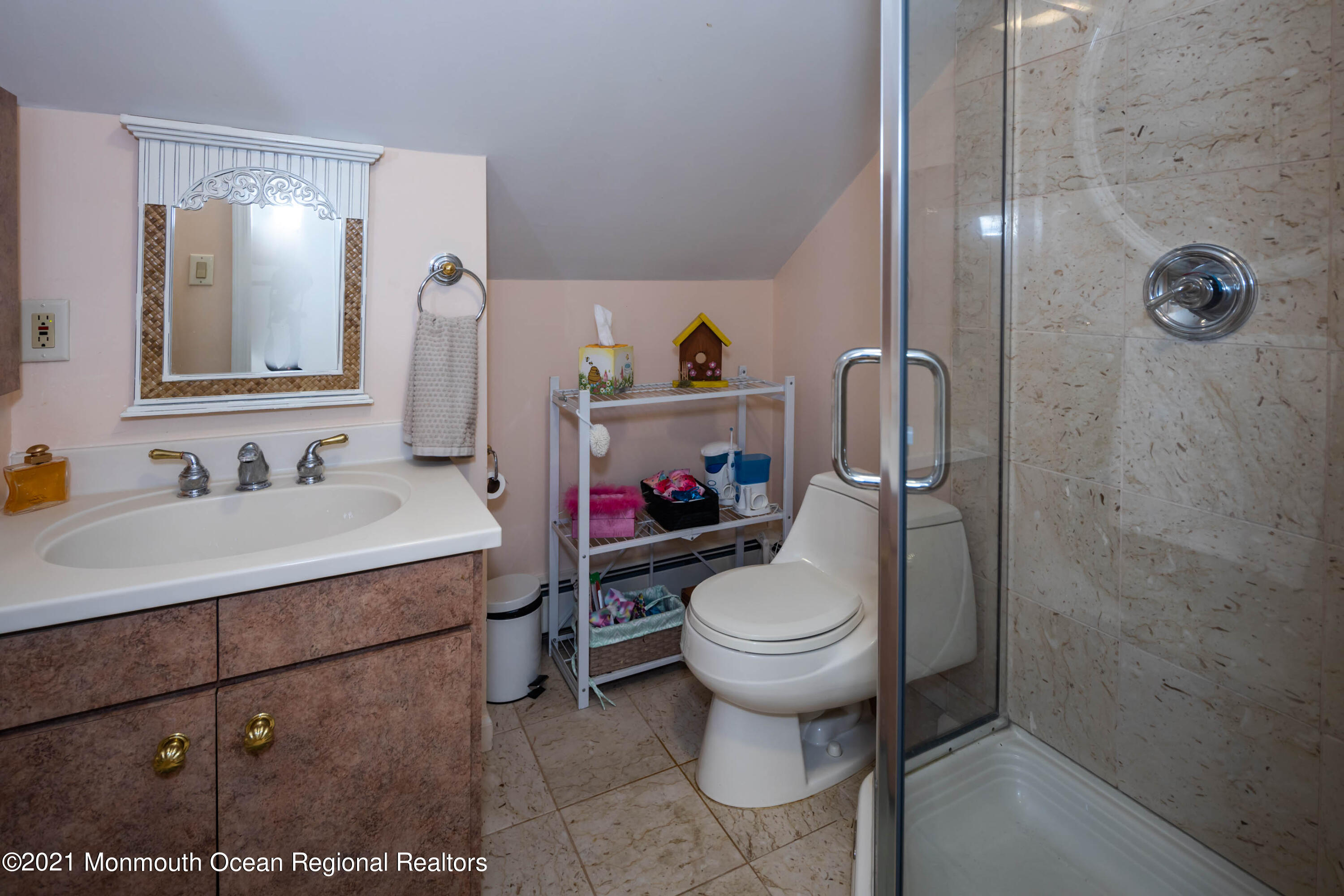 38 Conover Lane Red Bank, NJ 07701 - Photo 39 of 65 a bathroom with a sink toilet and shower