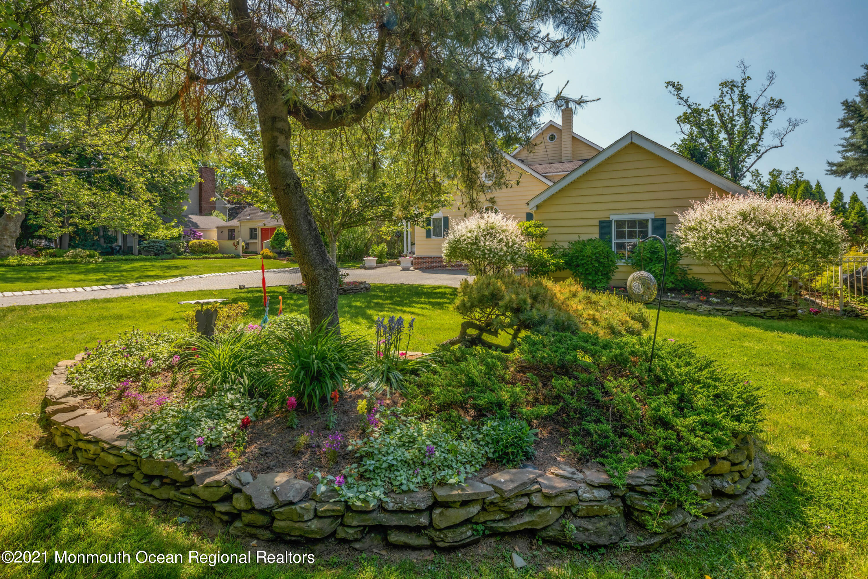 38 Conover Lane Red Bank, NJ 07701 - Photo 5 of 65 a front view of a house with garden