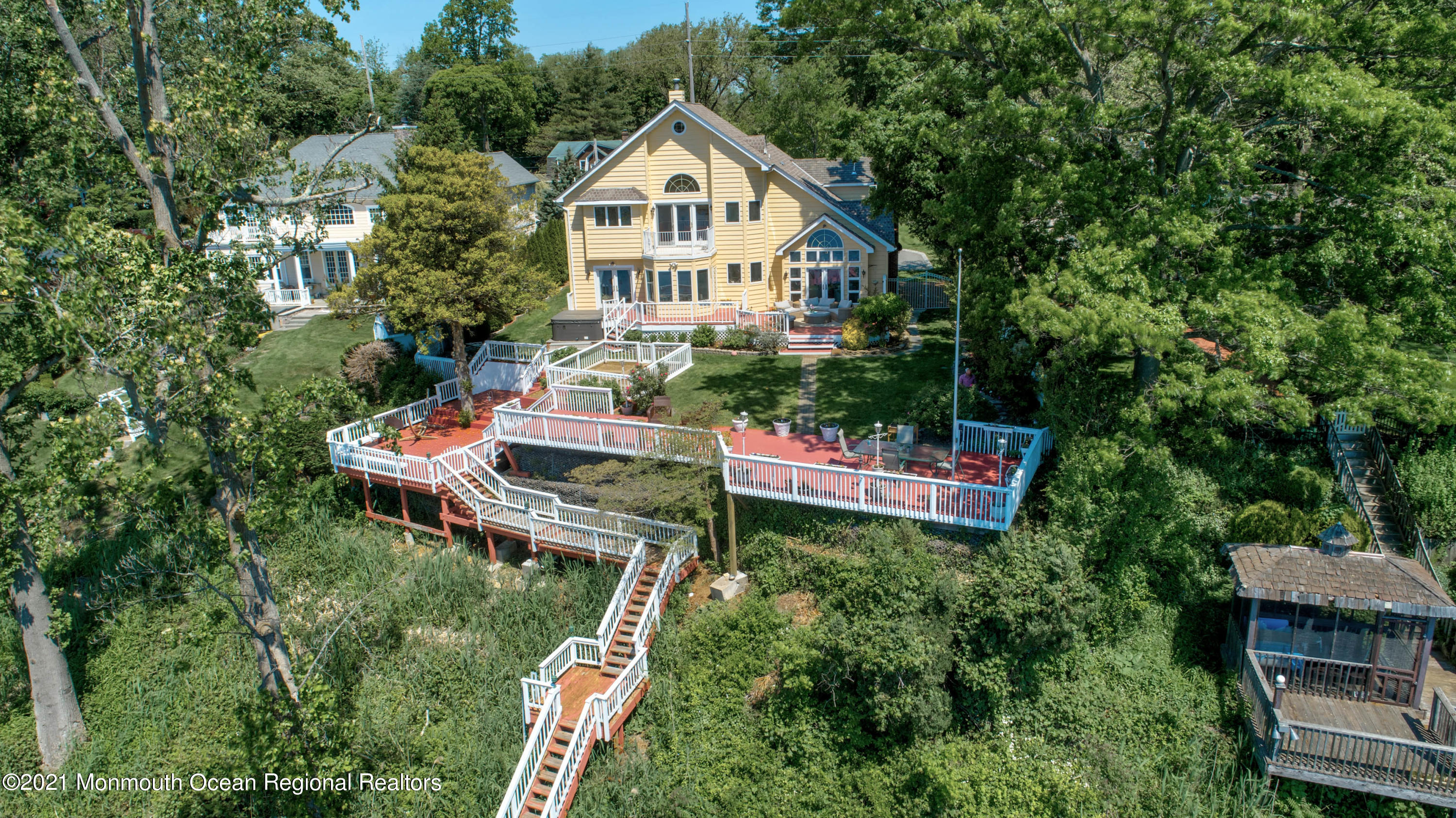 38 Conover Lane Red Bank, NJ 07701 - Photo 57 of 65 a house with lots of trees and flowers around it